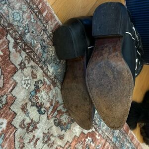 Handcrafted Cowboy boots from Texas.  Black with white design.  Size 7.